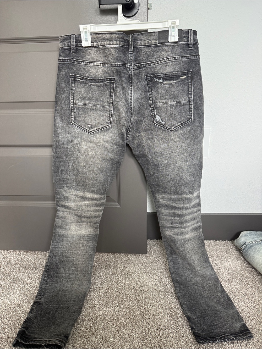 AMIRI Black Washed Skinny Jeans with Blue Patch Distressing - Picture 2 of 2